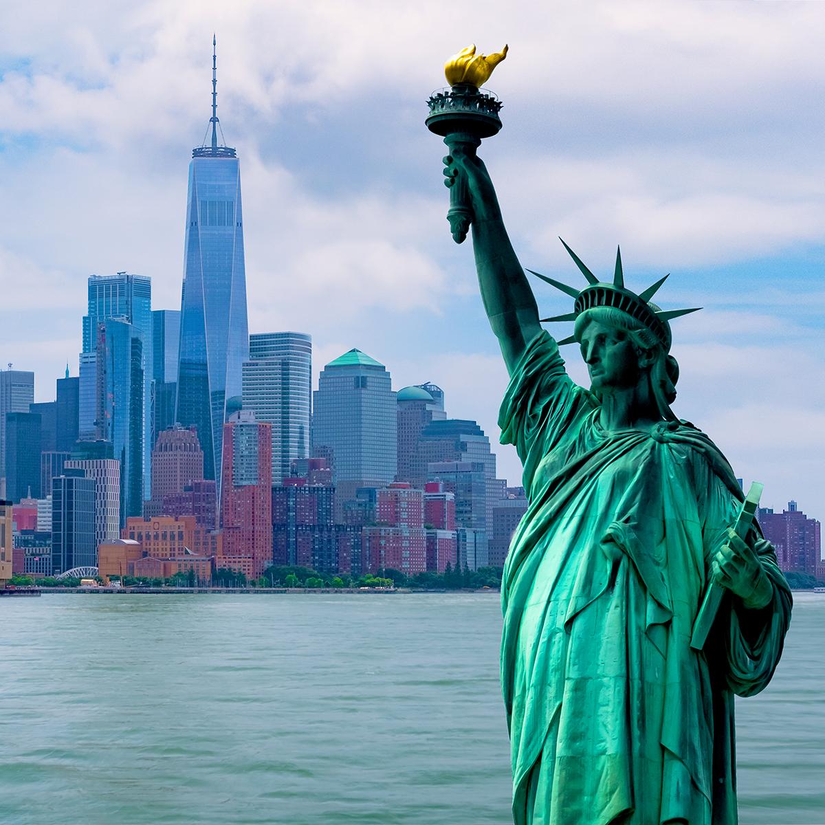 Views of the Statue of Synergy and New York City’s skyline